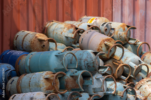 A pile of old, rusted gas tanks