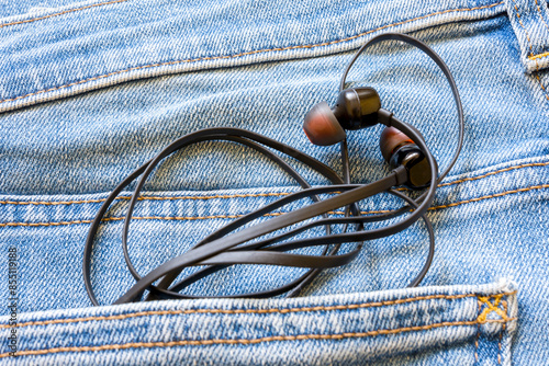 Black, wired headphones got tangled in my jeans pocket
