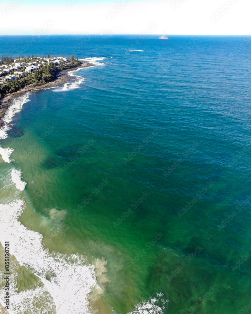 Stunning coastline in Queensland during autumn season with aerial view of the beach below. Taken at Kings Beach on the Sunshine Coast. Stunning coastline in Queensland during autumn season with aerial view of the beach below. Taken at Kings Beach on the Sunshine Coast.
