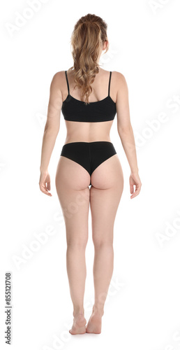 Woman with slim body posing on white background, back view