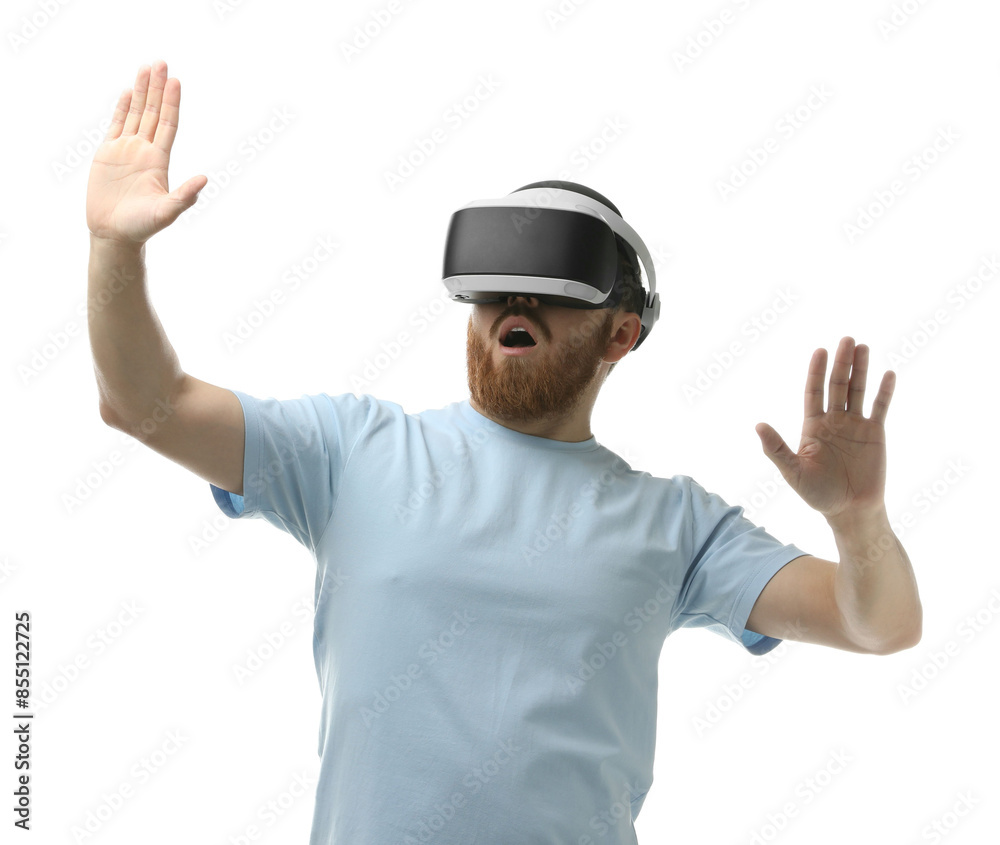 Emotional man using virtual reality headset on white background Emotional man using virtual reality headset on white background