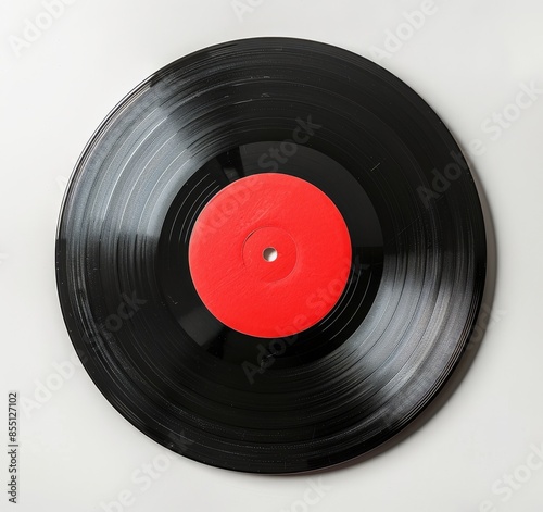 A Worn Vinyl Record With A Red Label On A White Background