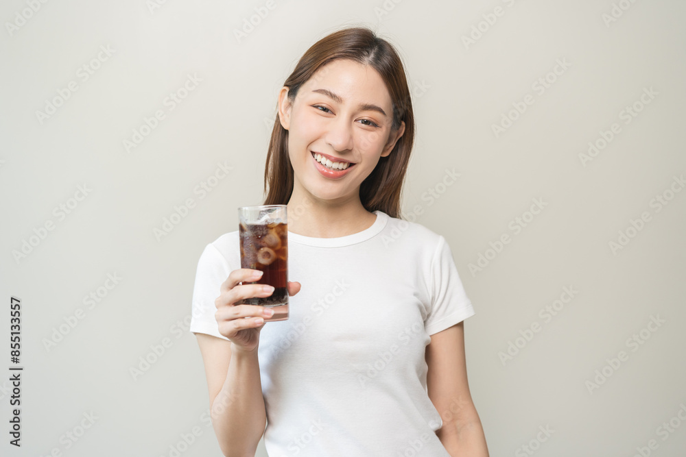 Thirsty, attractive asian young woman, girl drink or sip, holding a glass of cold sparkling water with ice in hand, refreshness people, isolated on white background. Temptation of food, health care. Thirsty, attractive asian young woman, girl drink or sip, holding a glass of cold sparkling water with ice in hand, refreshness people, isolated on white background. Temptation of food, health care.