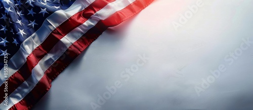 American Flag Draped Over White Background With Sunlight