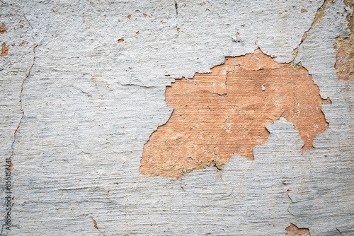 Crumbling color from the wall of the house, deterioration of the building