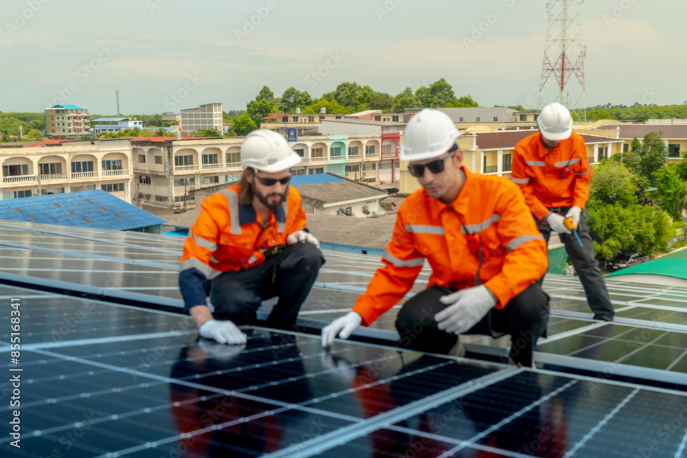 engineer men inspects construction of solar cell panel or photovoltaic cell by electronic device. Industrial Renewable energy of green power. factory worker working on tower roof. engineer men inspects construction of solar cell panel or photovoltaic cell by electronic device. Industrial Renewable energy of green power. factory worker working on tower roof.