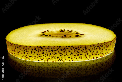 Macro Yellow kiwi and a black background
