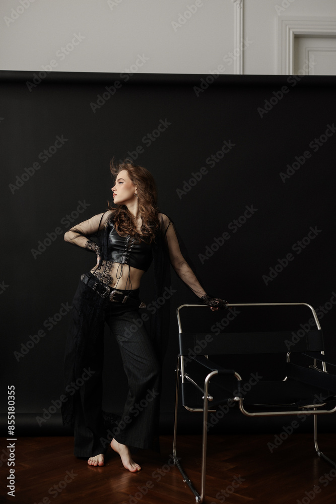 punk rock aesthetics with these captivating images of a young woman exuding confidence and style. Her black sheer blouse and layered piercings create a mesmerizing visual contrast punk rock aesthetics with these captivating images of a young woman exuding confidence and style. Her black sheer blouse and layered piercings create a mesmerizing visual contrast