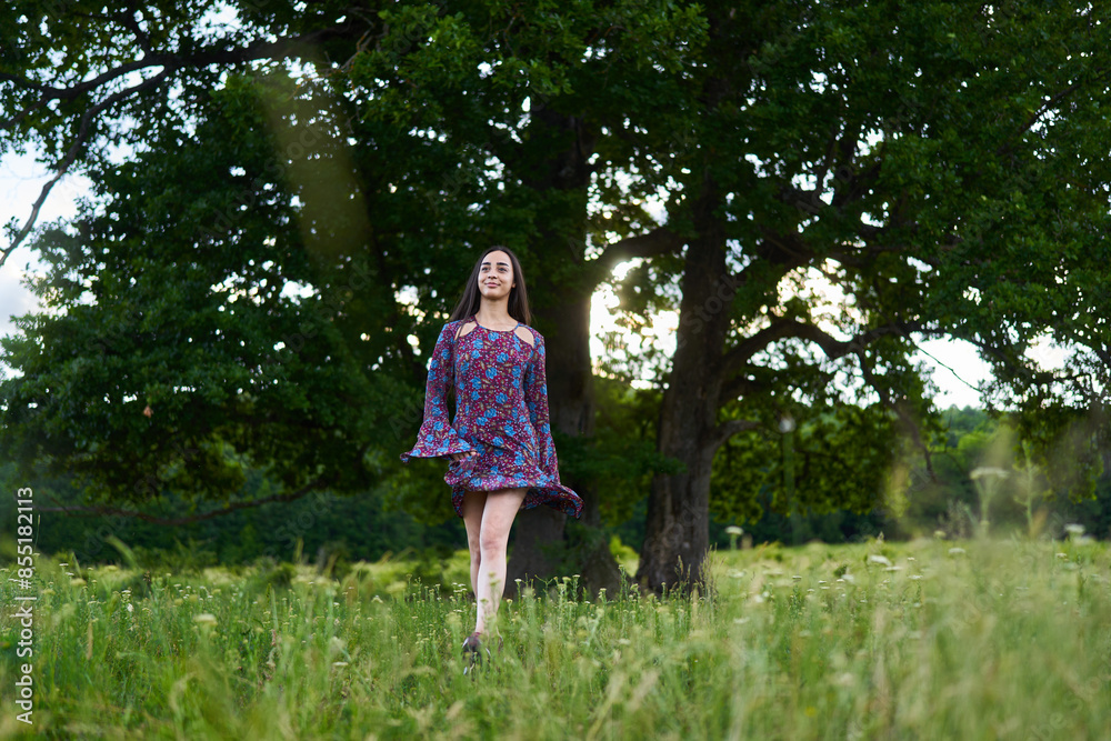 Gorgeous hispanic young woman on a meadow with oak forest Gorgeous hispanic young woman on a meadow with oak forest