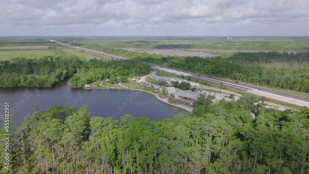 Aerial view of a highway and river in lush Louisiana. Natural beauty and infrastructure of the region under expansive skies Aerial view of a highway and river in lush Louisiana. Natural beauty and infrastructure of the region under expansive skies
