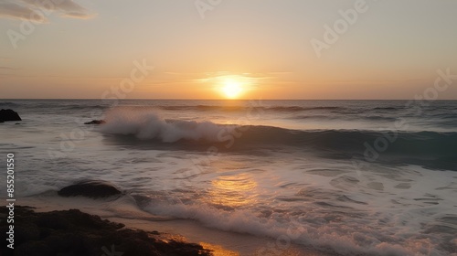 Peaceful ocean waves gently crashing as the sun sets on the horizon.
