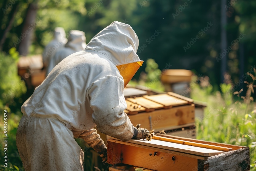 A beekeeper in a protective bee suit tends to a beehive, surrounded by buzzing bees A beekeeper in a protective bee suit tends to a beehive, surrounded by buzzing bees
