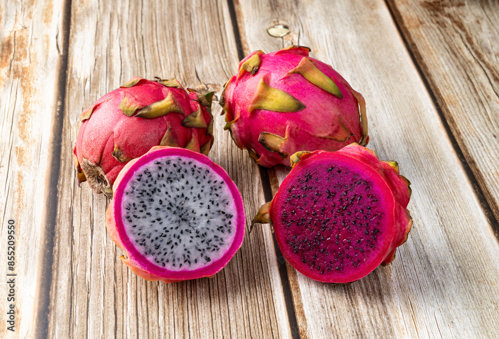 Pitayas or Dragon fruits over wooden table Pitayas or Dragon fruits over wooden table