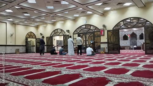 Farwaniya, Kuwait - June 18 2024 : People praying in the mosque. photo