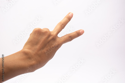 raising two fingers up on hand it is shows peace strength fight or victory symbol, peace sign, number two or letter V in sign language isolated on white. back side of the hand.