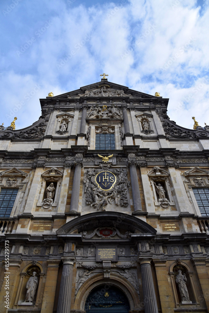 A baroque church in Antwerpen, Belgium, called St. Charles Borromeo Church, as seen from below with blue sky and clouds. 17th century architecture. A baroque church in Antwerpen, Belgium, called St. Charles Borromeo Church, as seen from below with blue sky and clouds. 17th century architecture.