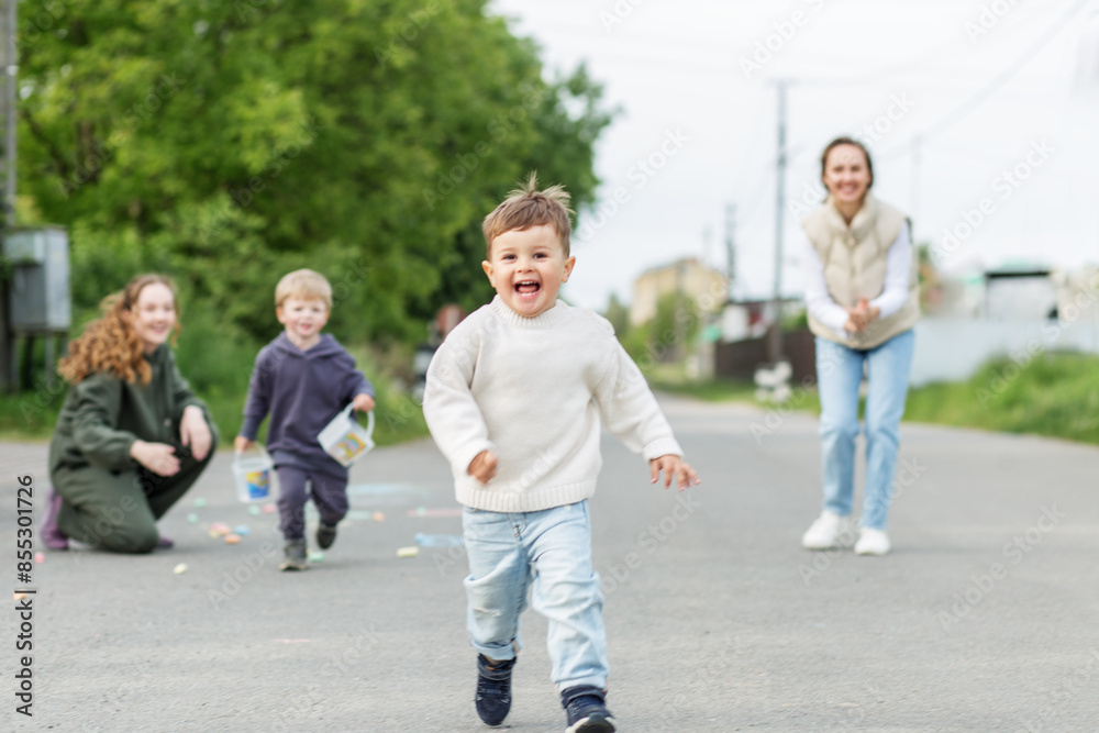 Children running and playing on sunny day Children running and playing on sunny day
