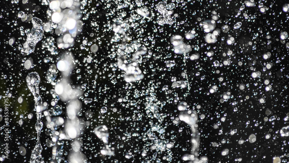 Obraz premium Flying water drops on black background