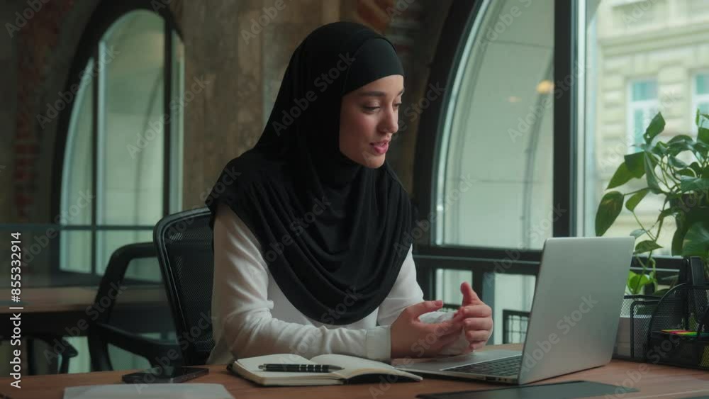 Arabian islamic woman in hijab happy muslim businesswoman girl female business coach virtual chatting online laptop computer conference video call greeting hello friendly internet communication smile Arabian islamic woman in hijab happy muslim businesswoman girl female business coach virtual chatting online laptop computer conference video call greeting hello friendly internet communication smile