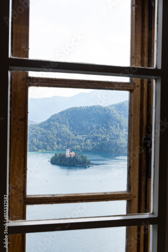 Panoramic view from Lake Bled, beauty heritage in Slovenia. Island with church and castle in the background create a dream setting. View from the castle, museum and court.