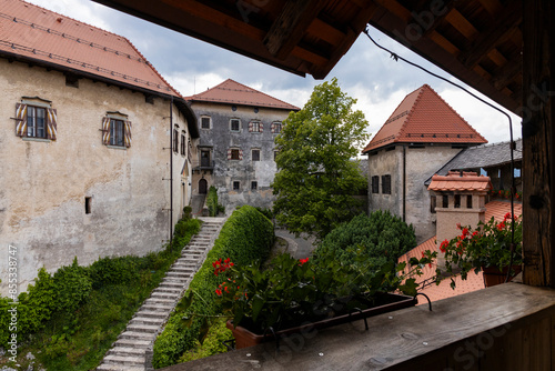 Panoramic view from Lake Bled, beauty heritage in Slovenia. Island with church and castle in the background create a dream setting. View from the castle, museum and court.