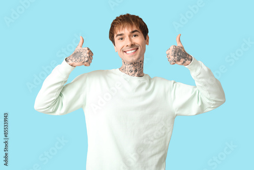 Happy handsome young tattoo...