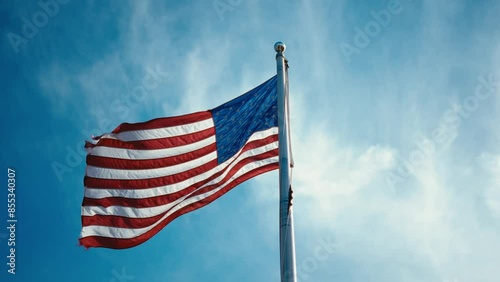 Waving American flag in the wind, symbolizing patriotism and freedom. Perfect for celebrating Independence Day on July 4th. High-quality footage for national pride and patriotic events.