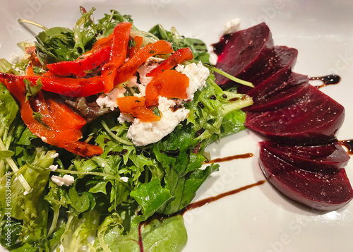 Arugula salad with beets, grilled peppers and ricotta cheese