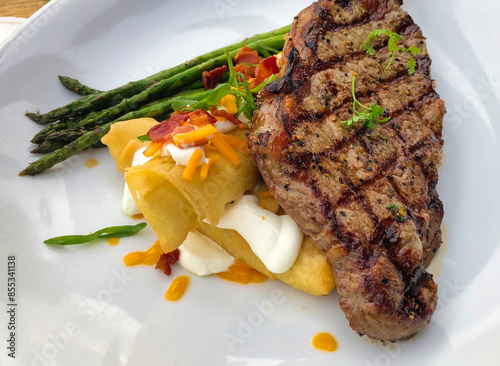 strip-loin steak with crispy mashed potatoes and asparagus