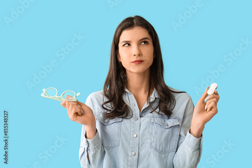 Thoughtful young woman with...