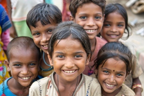 Group of indian children smiling at the camera. Selective focus. © Asier