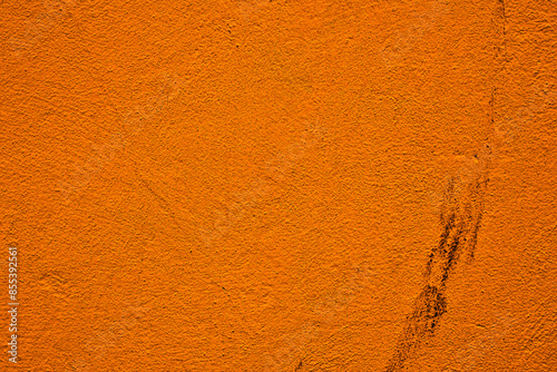 Closeup of orange dirty plastered wall