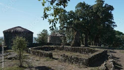 Archaeological site of the historical roman ruins of Citania de Briteiros near Guimaraes and Braga, situated high on hill overlooking the landscape. photo