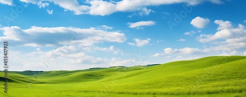 rolling hills under a blue sky with white clouds