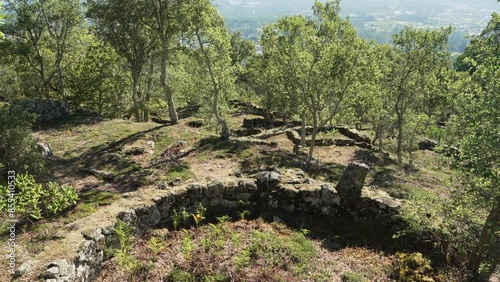 Archaeological site of the historical roman ruins of Citania de Briteiros near Guimaraes and Braga, situated high on hill overlooking the landscape. photo