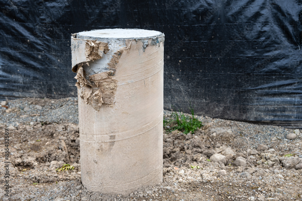 Closeup of new house construction project, pressed paper foundation pylon support with cement poured and curing, residential job building site
Closeup of new house construction project, pressed paper foundation pylon support with cement poured and curing, residential job building site