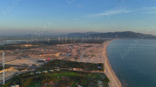 Wind turbines at FLC Nhon Ly seaside, turbine rotating to make green alternative energy with cheap for indusrtry and save environment