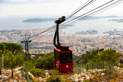 Photo of cable car to Mount Faron, view of French city Toulon in background. photo