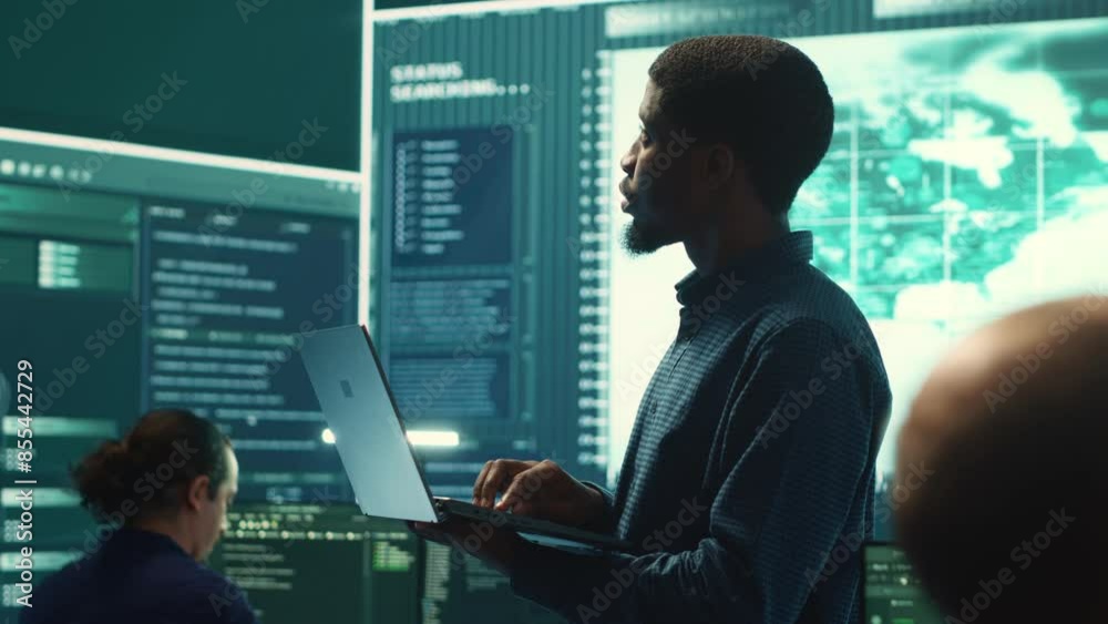 Cyber security team investigates governmental hacking malware attack on internet servers, high tech office. Cybercriminals hack computer systems, threatening account database protection. Camera A.