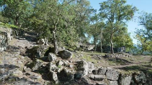 Archaeological site of the historical roman ruins of Citania de Briteiros near Guimaraes and Braga, situated high on hill overlooking the landscape. photo