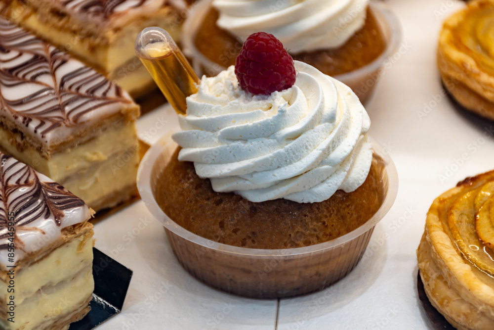 French cuisine, fresh baked baba au rum strawberry cake with chantilly cream, sweet dessert with rum French cuisine, fresh baked baba au rum strawberry cake with chantilly cream, sweet dessert with rum
