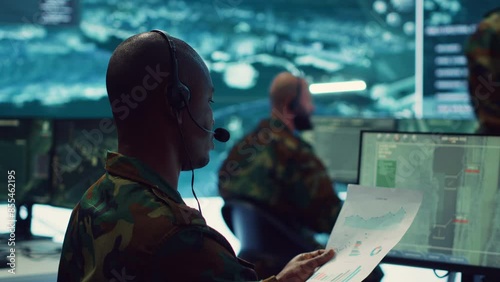 Military personnel execute electronic intelligence gathering missions to intercept enemy communications or warships gps positions. Soldiers conducting reconnaissance operations. Camera A.