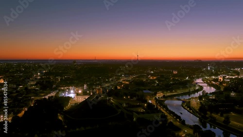 Scenic aerial view of Vilnius Old Town and Neris river at nightfall. Sunset landscape. Night view of Vilnius, Lithuania. photo