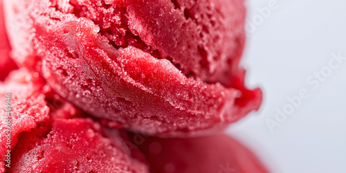 Chic rhubarb sorbet, a closeup of chic rhubarb sorbet, its bright red color and icy tanginess highlighted against a white backdrop