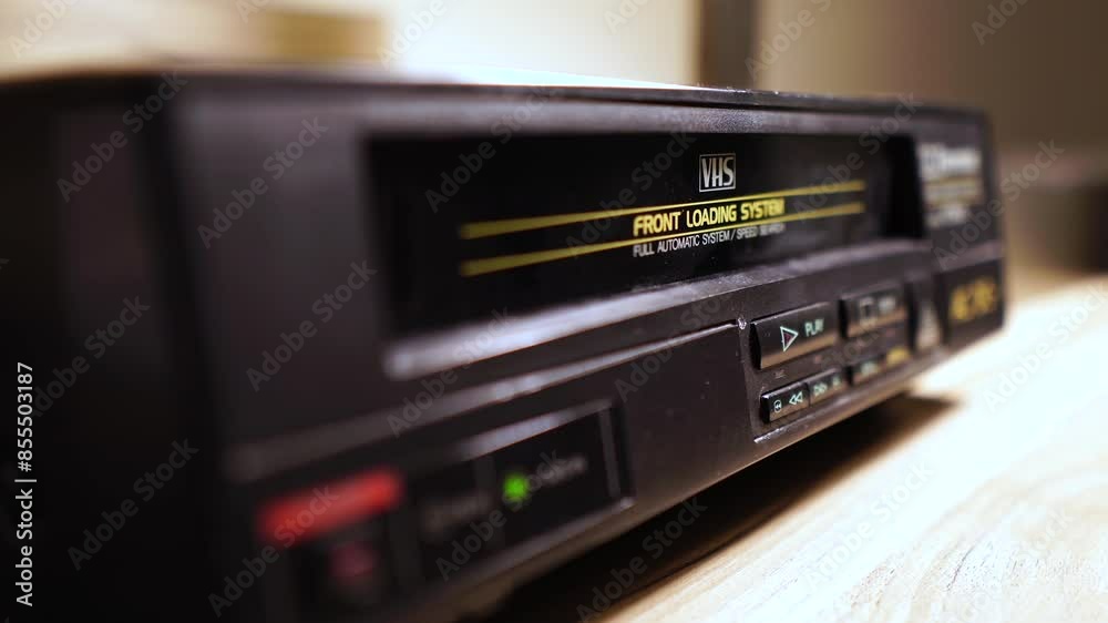 Loading and Starting Playback of VHS VIdeo Cassette Tape in VCR From 1990's, Close Up Loading and Starting Playback of VHS VIdeo Cassette Tape in VCR From 1990's, Close Up