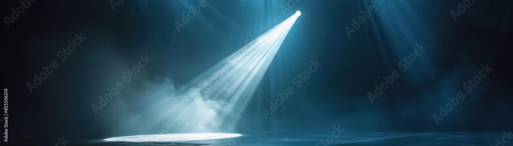 Fototapeta premium Single spotlight shining on center stage, direct beam of light, revealing stardom and performance