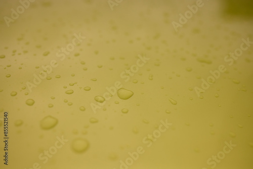 A serene image of water droplets on a smooth surface, capturing a tranquil and peaceful scene