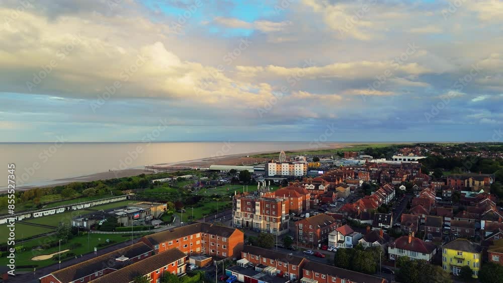 Looming storm over the seaside town of Skegness. English Holiday reasort showing caravan sites and hotels with stormy sky’s over the ocean. British Coastal scene with bad summer weather.
