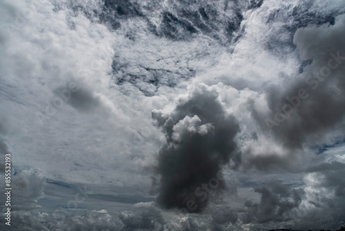 Fototapeta Naklejka Na Ścianę i Meble -  Dark rain cloud dramatic sky summer tropical thunder storm sky and fluffy black darkness cloud nearly raining cloudscape. Nimbus raincloud skyline climate background. Dark gray sky cloudy environment
