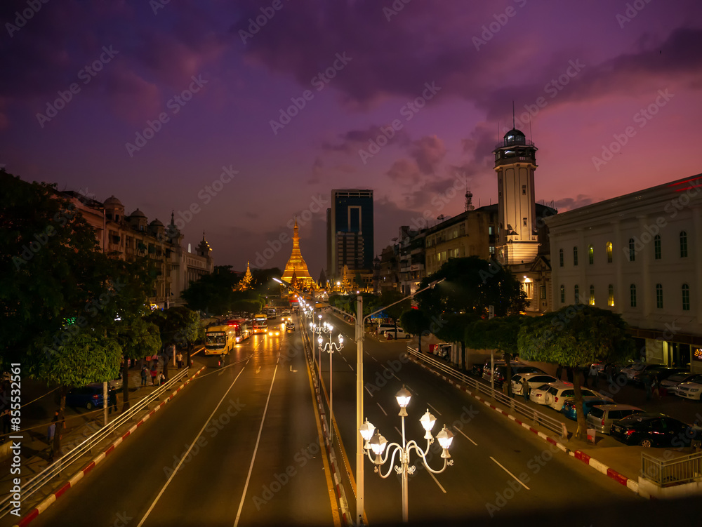 Fototapeta premium Streets of downtown Yangon on the road to Sule Pagoda time lapse with traffic jam and modern city